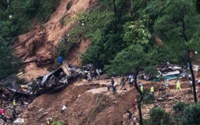 10 people dead after a landslide buries a house in the southern Philippines, officials say