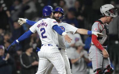 Swanson’s tiebreaking 2-run homer, Suzuki’s grand slam lift Cubs past Reds 7-5 at wet Wrigley Field